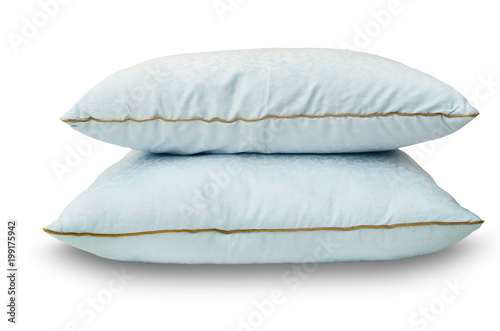 Two blue feather pillows lie one on one  group   isolated on white background