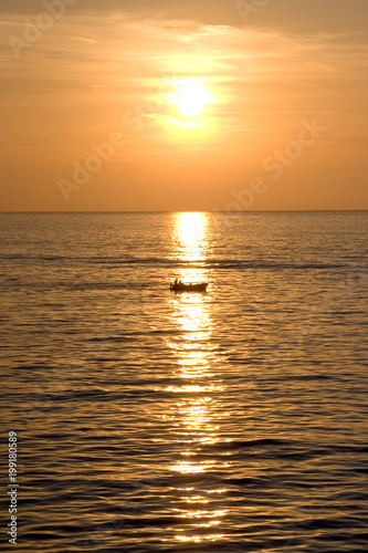 boat at sunset on the Mediterranean sea © Giuma