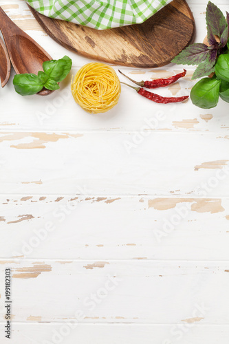 Cooking table with utensils and ingredients