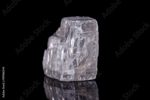 Macro mineral stone Iceland spar on black background photo