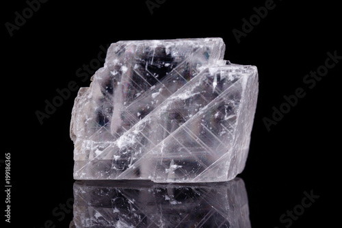 Photos Macro mineral stone Iceland spar on black background