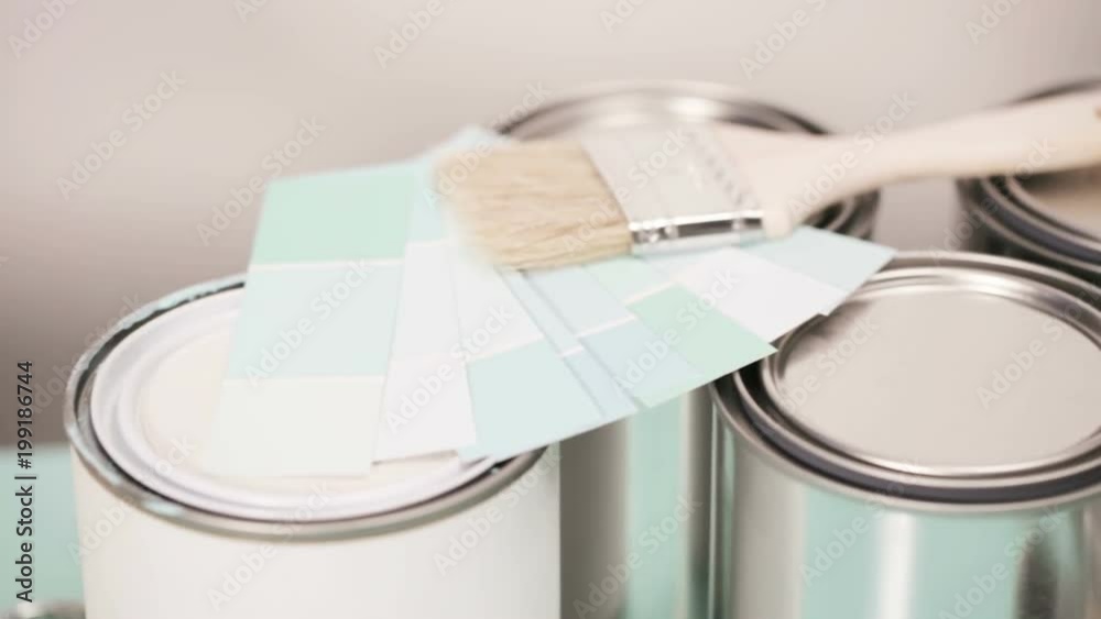 Supplies to start house painting project. Metal paint cans, paint