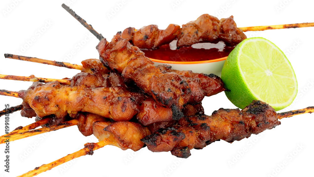 Sticky chicken skewers with chilli sauce dip isolated on a white background