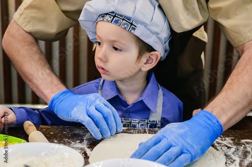 Children make pizza. Master...