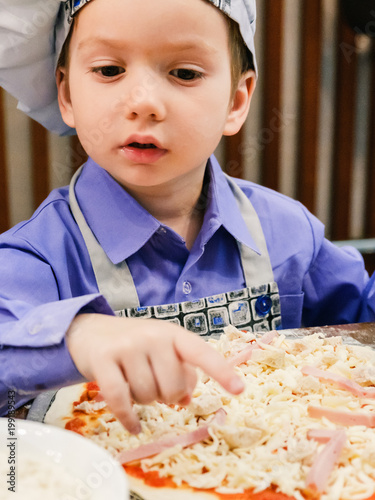 Children make pizza. Master...