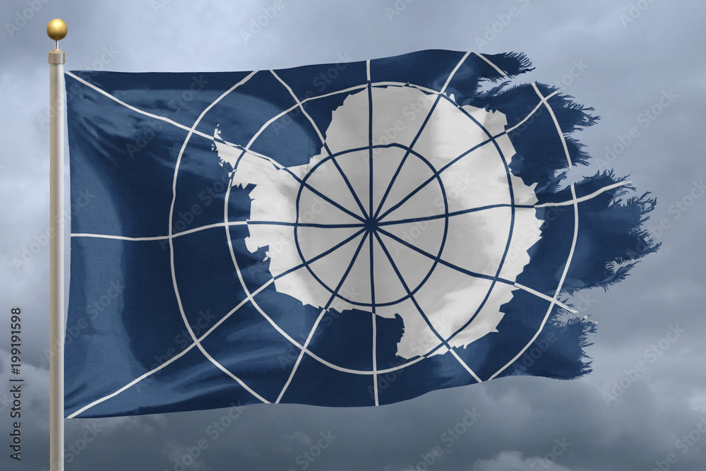 Antarctica treaty Flag with torn edges in front of a stormy sky