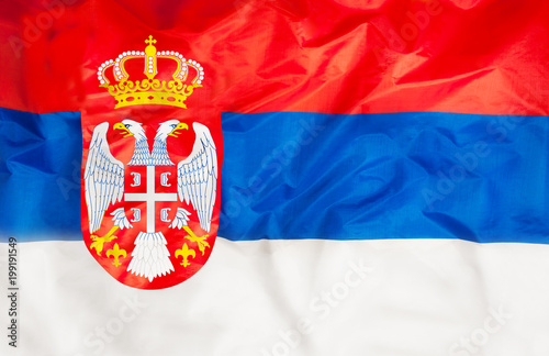 Serbia national flag with waving fabric 