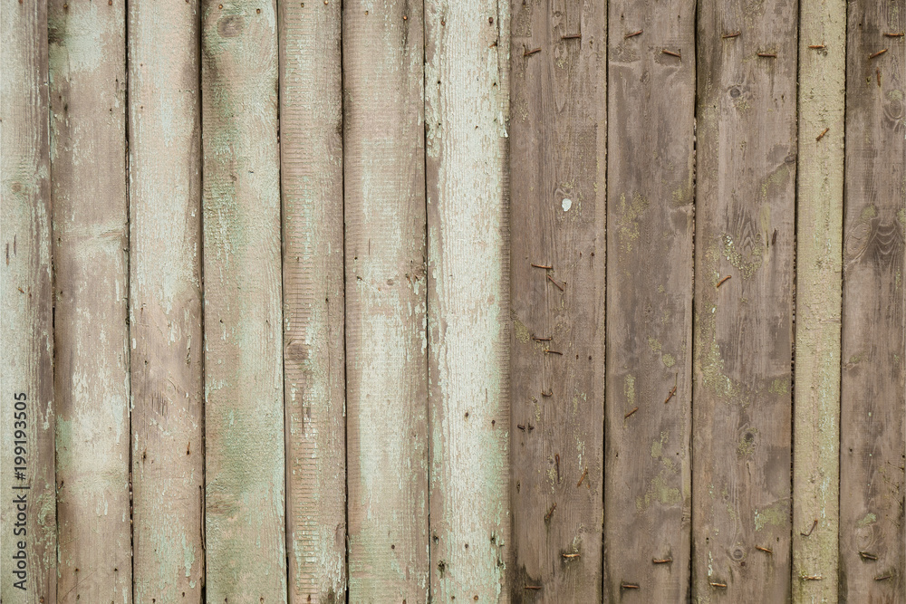 Background old wooden fence with rusty nails. with peeling paint. Background old wooden fence with rusty nails. with peeling paint.