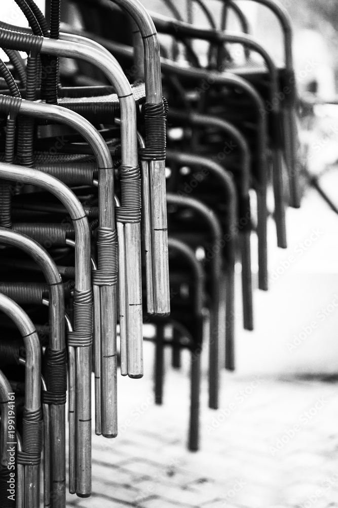 Black and white rhythmic composition of chairs.