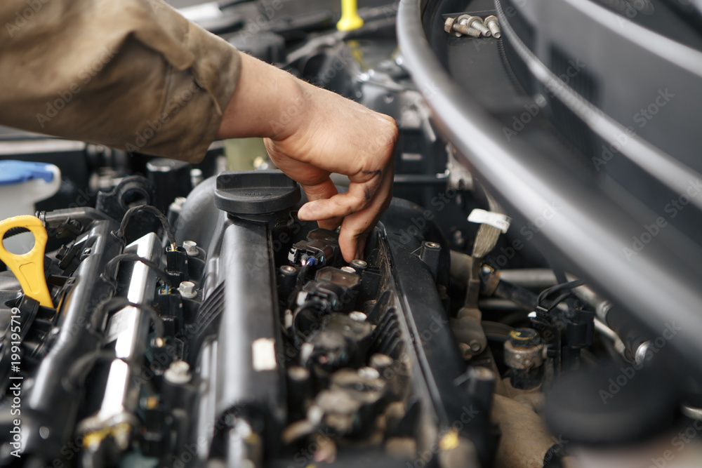 Technicians are checking car engines. Technicians are checking car engines.