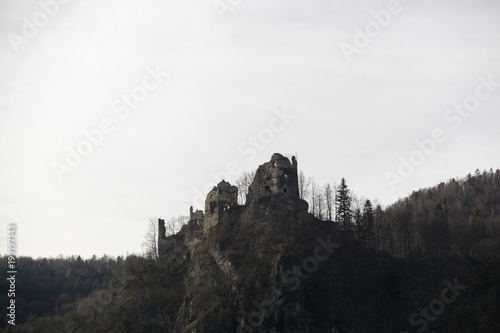 Castle on the rock in colorful woods during spring. Slovakia