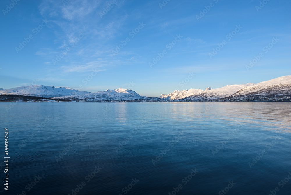 Obraz premium Bright landscapes taken from the waters of the Fjords around Tromsø, Norway