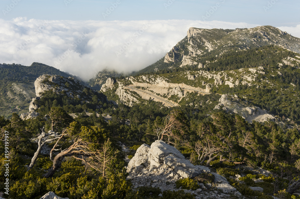 Rocky andscape at Puertos de Beceite (Ports de Beceit) with clouds over the mountains Rocky andscape at Puertos de Beceite (Ports de Beceit) with clouds over the mountains
