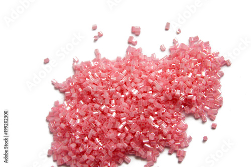 pink beads for craft on isolated background