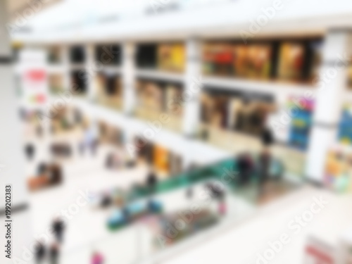 Shopping mall blur background with bokeh. Blurred hall of shopping mall as background