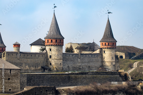 Kamianets Podilskyi fortress built in the 14th century. View of the fortress wall with towers at early springtime, Ukraine