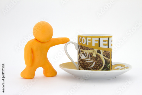 Orange plasticine character and cup of coffee. Coffee set. Isolated over white background