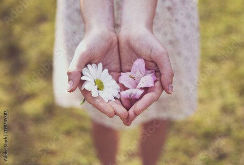 Girl shows the blooms in her hand