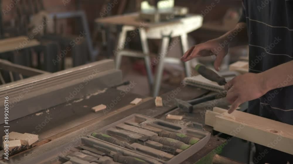 Working with chisel and hammer Working with chisel and hammer