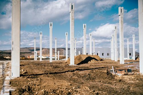 Industrial construction site with prefabricated concrete pillars