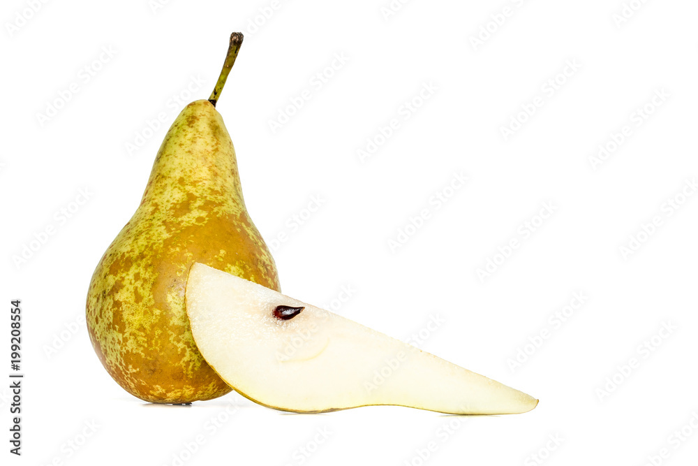 Green whole pear next to a slice piece of pear isolated on white background