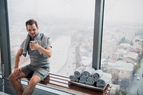 Photography Handsome man taking a selfie with mobile phone after indoors training