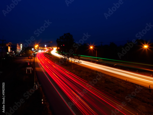 moving car with blur light through city at night