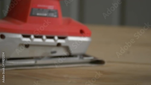 Brushing a piece of wood photo
