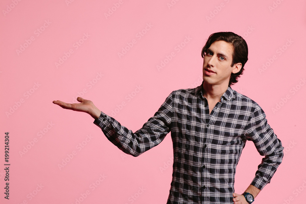 Portrait of a young man with hand to the side Portrait of a young man with hand to the side