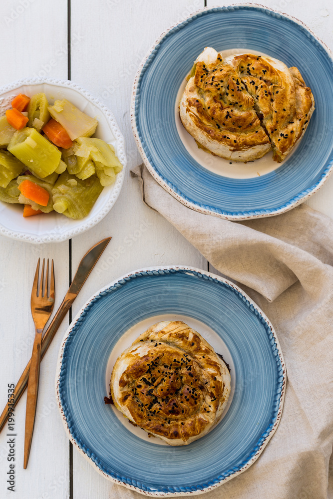 Turkish pastry borek in blue ceramic plates Turkish pastry borek in blue ceramic plates