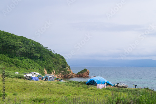 A tourist camp on the shore of the picturesque bay of Putyatin Island in Primorsky Krai. photo