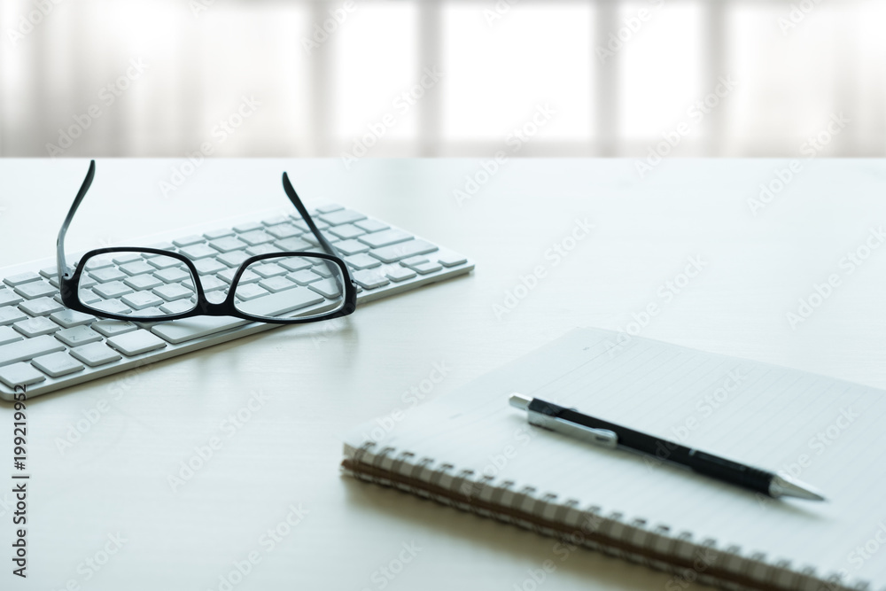 Close up of glasses and computer business workplace work place in office Close up of glasses and computer business workplace work place in office