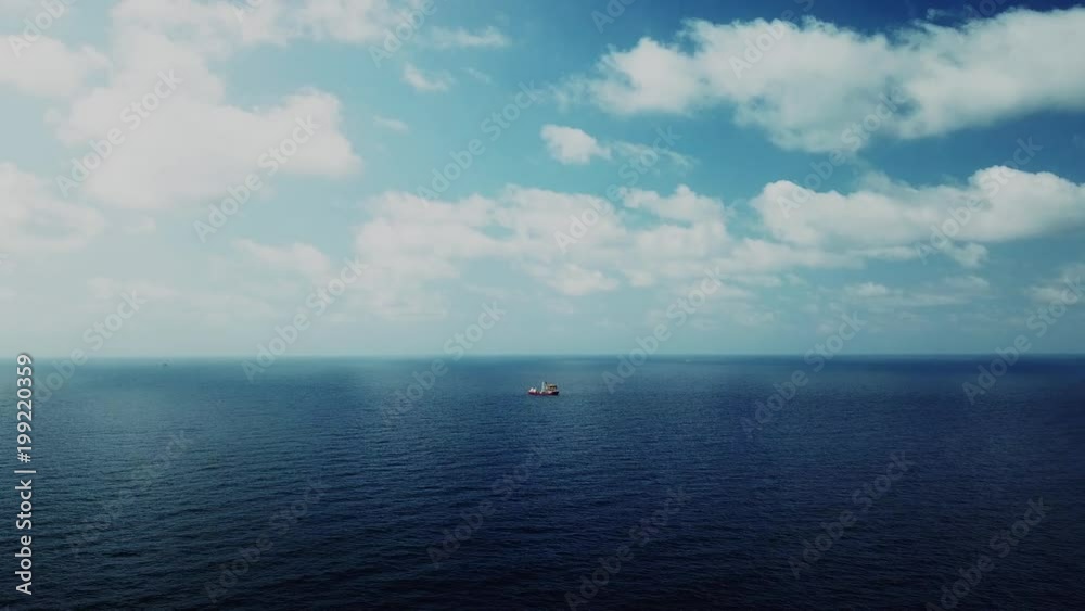 An aerial view from a drone of a soil boring boat (a geotechnical drilling cum analogue survey vessel) close to a oil platform
An aerial view from a drone of a soil boring boat (a geotechnical drilling cum analogue survey vessel) close to a oil platform