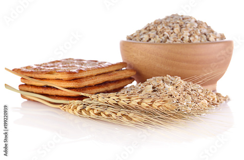 Barley ear and biscuits isolated on white background