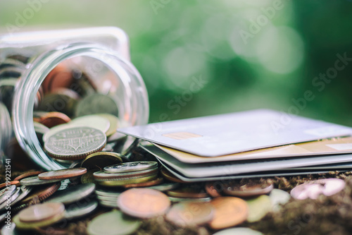 Coin in the glass jar and c...