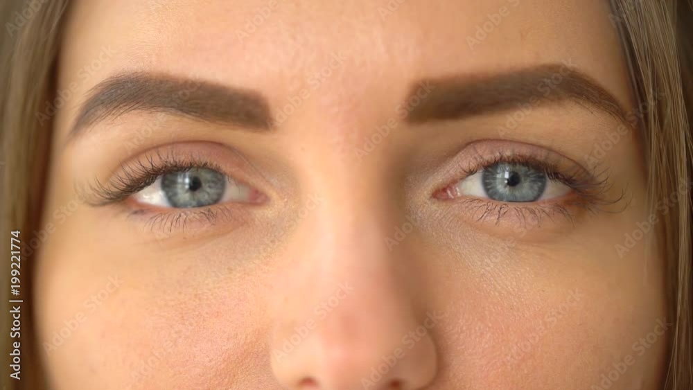 Close-up shot of a woman opening her blue eyes with light day make-up and focusing them. Shot on RED Cinema Camera in 4K (UHD). attractive beautiful young woman opens her beautiful blue eyes. Close-up shot of a woman opening her blue eyes with light day make-up and focusing them. Shot on RED Cinema Camera in 4K (UHD). attractive beautiful young woman opens her beautiful blue eyes.