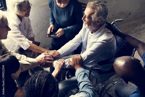 Group of people encouragement to senior man