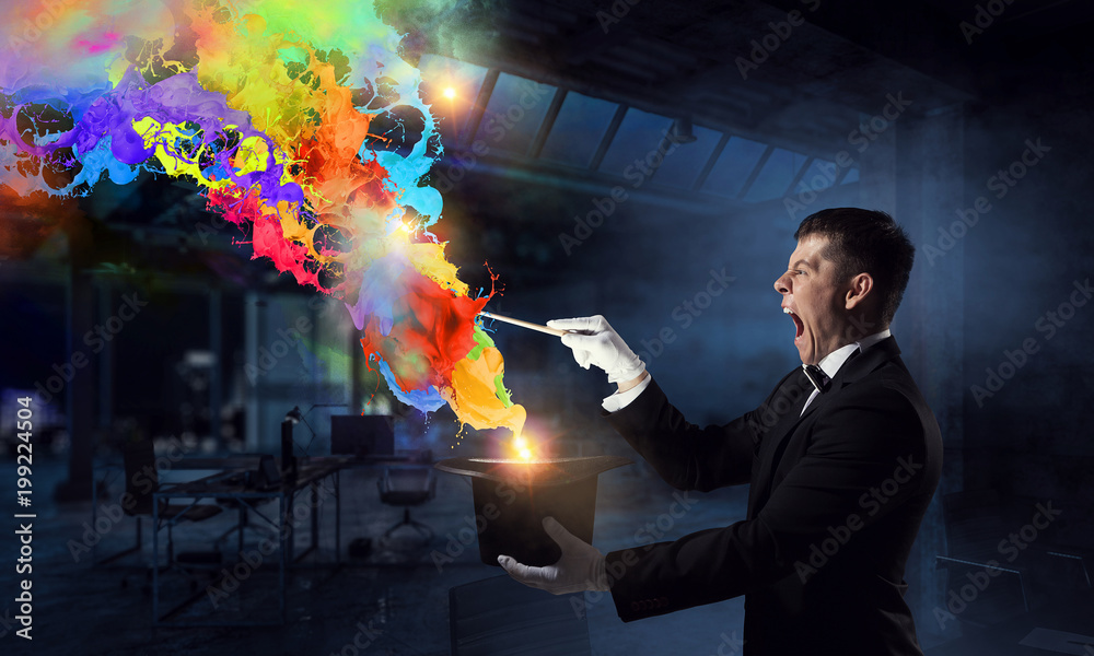 Businessman demonstrating magic . Mixed media Businessman demonstrating magic . Mixed media