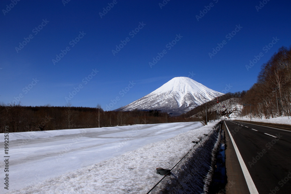 Landscape of Mt. Yotei seen from village of kimobetsu in Hokkaido in winter