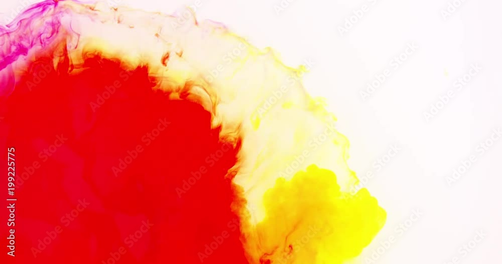 Red and yellow ink mixing together in slow motion Red and yellow ink mixing together in slow motion