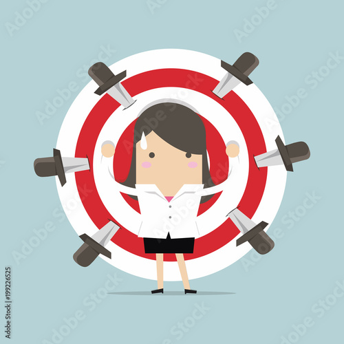 Businesswoman on target with knives vector