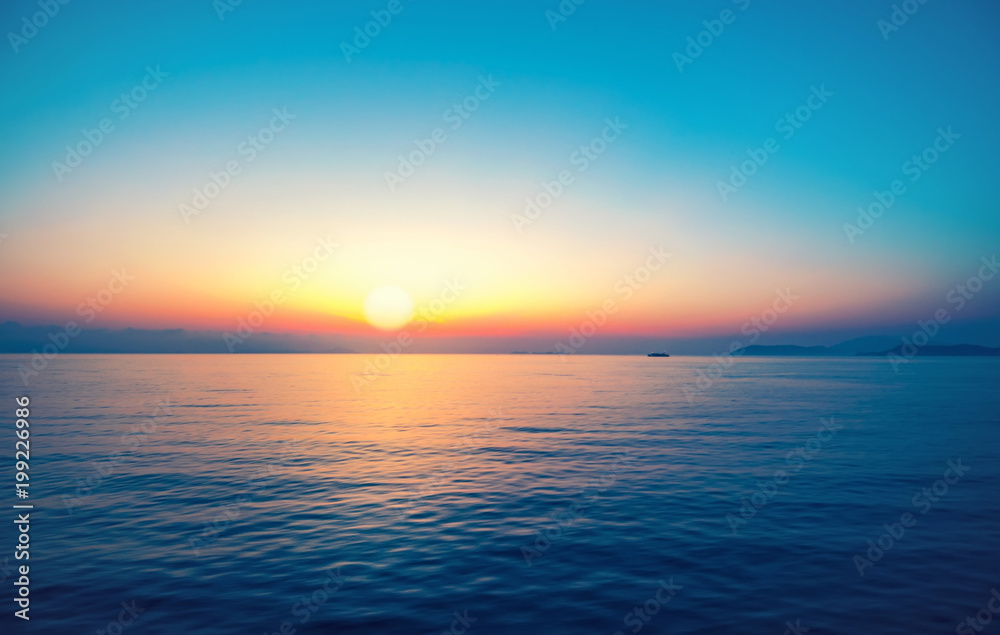 Beautiful tropical sunrise reflacted on sea surface, Thailand