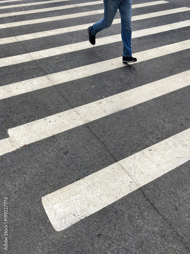 Zebra crossing with a person walking