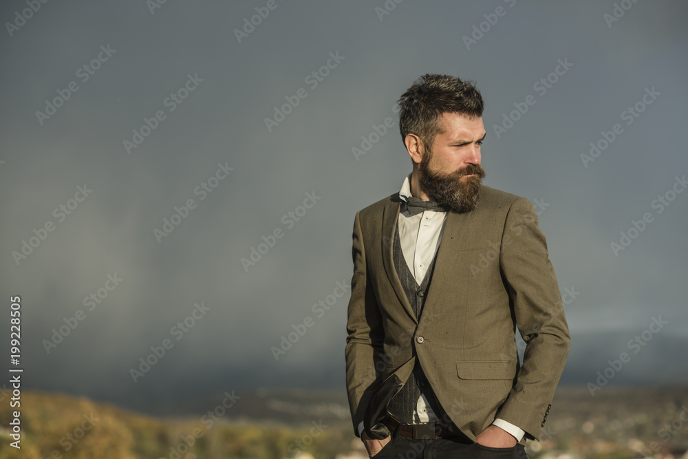 Guy with strict face enjoys scenery and view. Guy with strict face enjoys scenery and view.