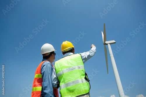 Male Engineer or technician at Work wind turbine station,wind enegy concept