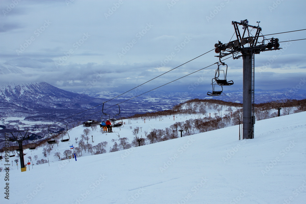 People who enjoy skiing at the Niseko Hirafu ski field in Hokkaido People who enjoy skiing at the Niseko Hirafu ski field in Hokkaido