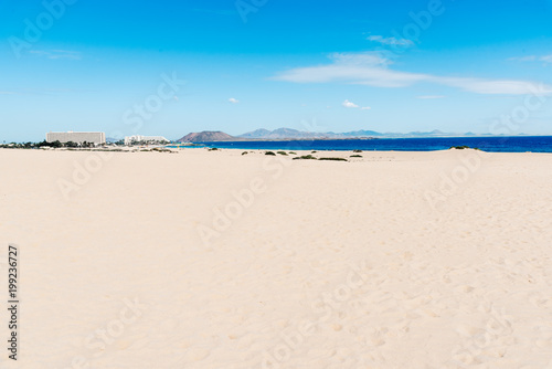 Scenic view of sea and desert landscape