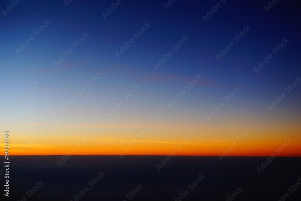 Abstract Sunset Photo from Airplane, Sunset sky background, pictured from  plane. Beautiful sky as twilight times, Space for text in template. 