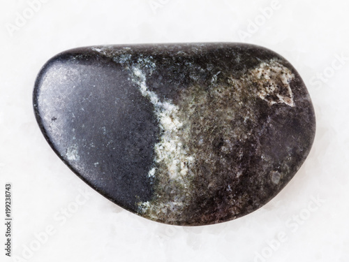 tumbled olivinite stone on white