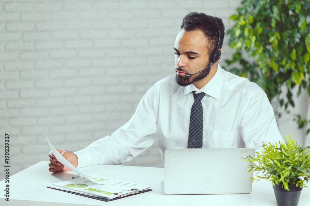 Man with headphones. Call center operator speaking with client Man with headphones. Call center operator speaking with client